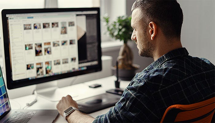 a men working on desktop
