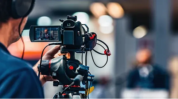 A man is holding camera and recording the video