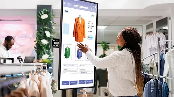 A woman shopping using digital display